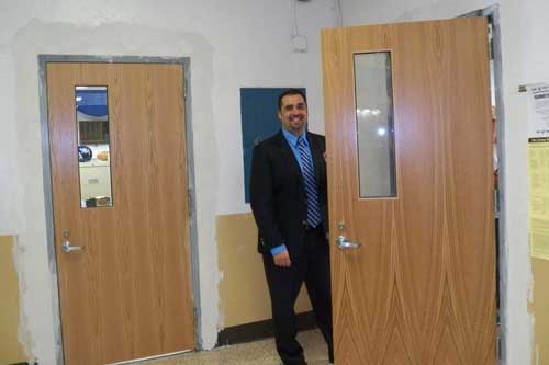 Mr. Manuppelli opens the new main office door